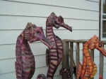 A trio of carved Hippocampus.